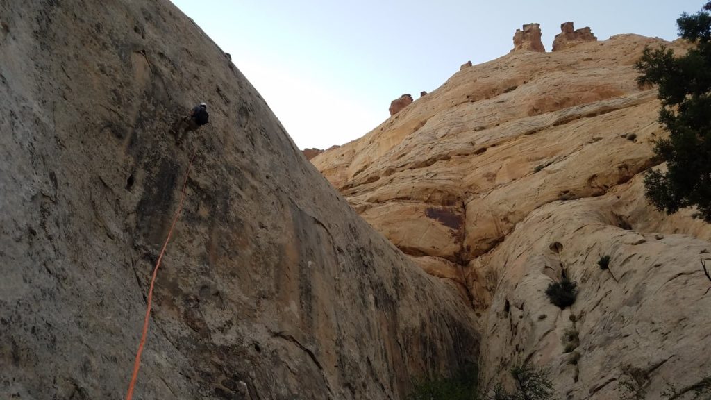 Person repelling down a canyon in Capitol Reef National Park