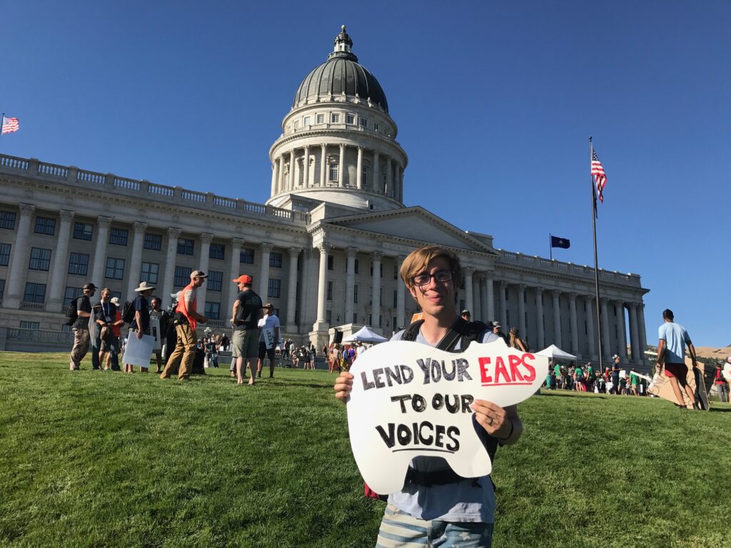 Protester holding a bear-shaped sign