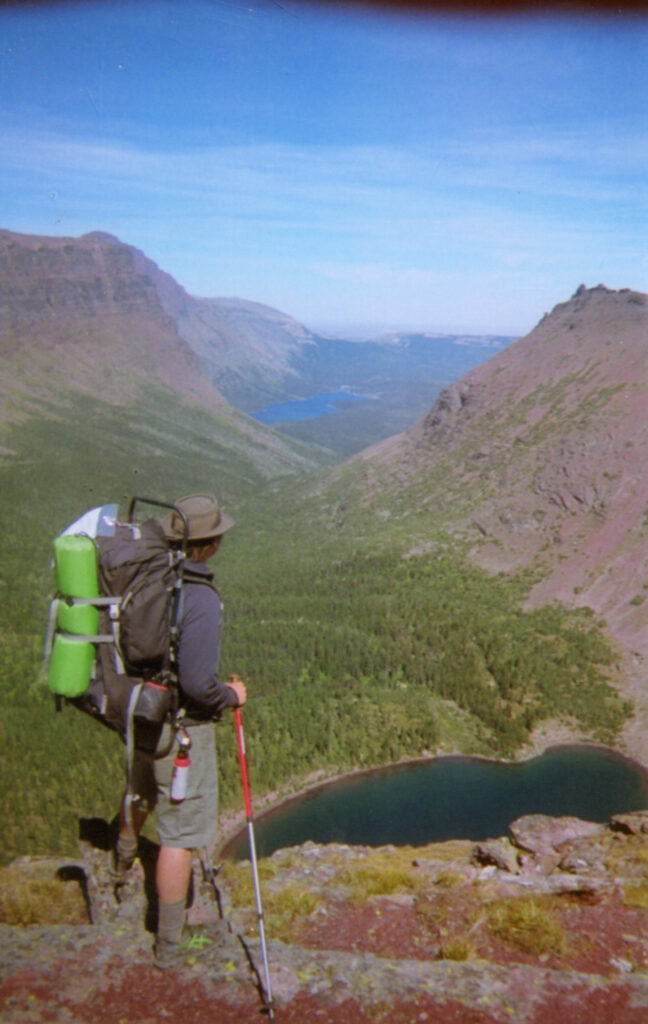 Man overlooking Two Medicine Lake form mountain pass