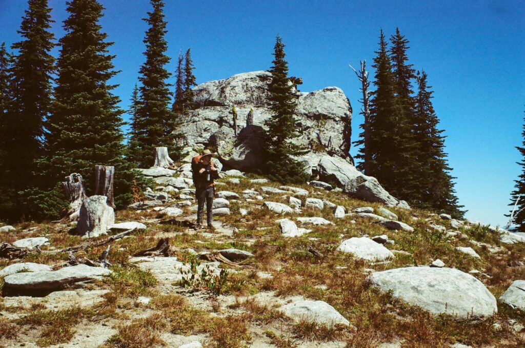 Man by rocks on mountain