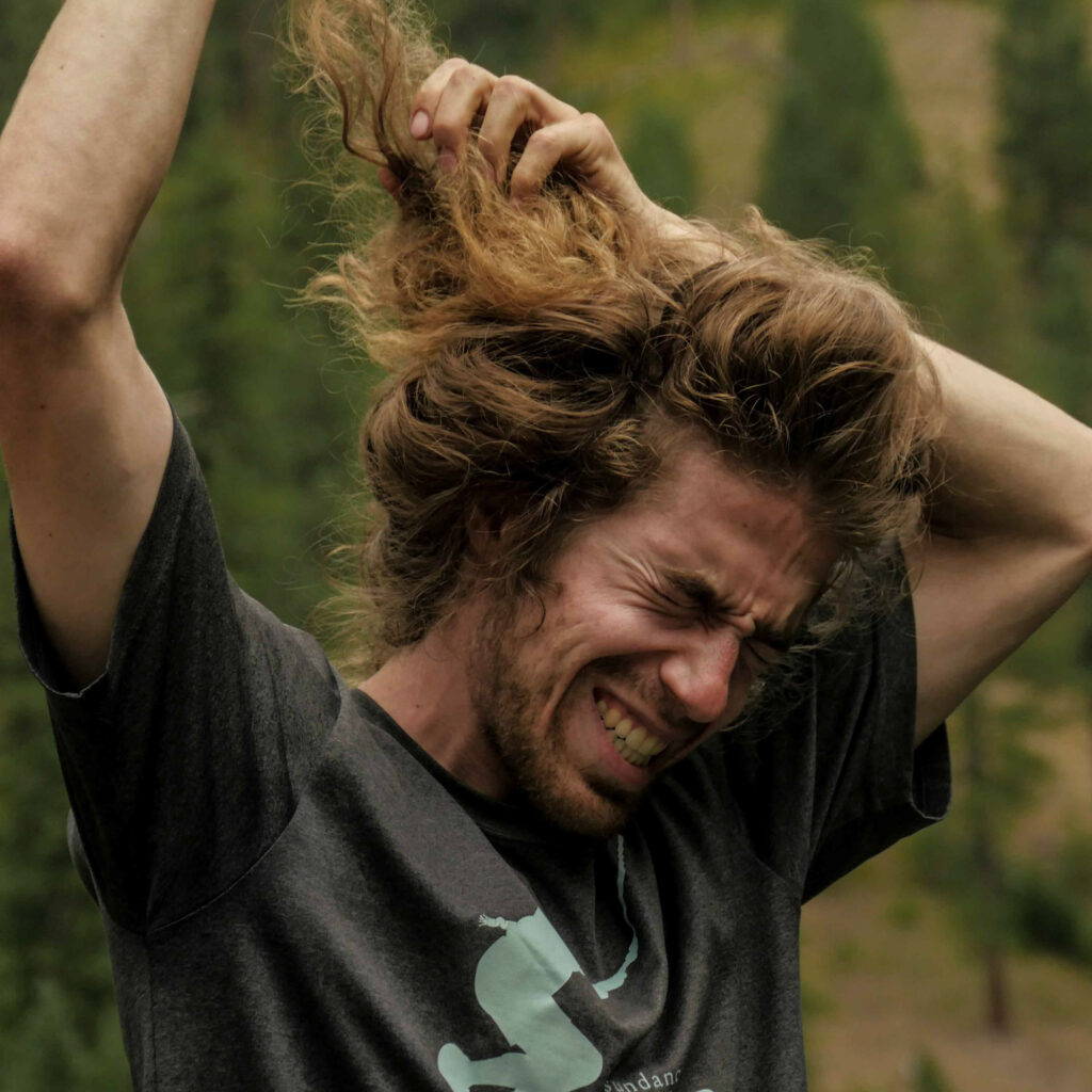 Bret removing hair from bun